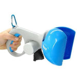 Dog waste scooper with blue bin and white handle, held in a person’s hand.