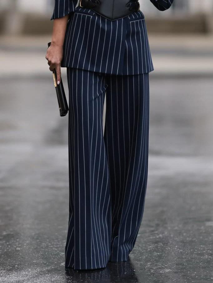 High-waist navy pinstripe wide-leg pants with black waist belt