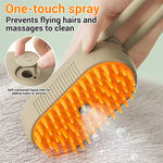 Electric steam pet brush with orange bristle head and beige sprayer casing
