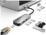 USB-C hub docking station side view with multiple ports, gray body and connected cables