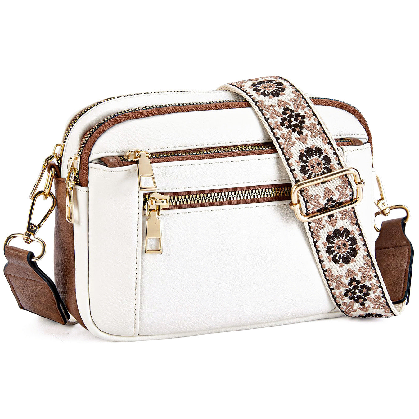White crossbody bag with floral embroidered strap and gold hardware, side view