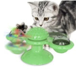 Green rotating windmill cat toy with spring balls and two circular side discs