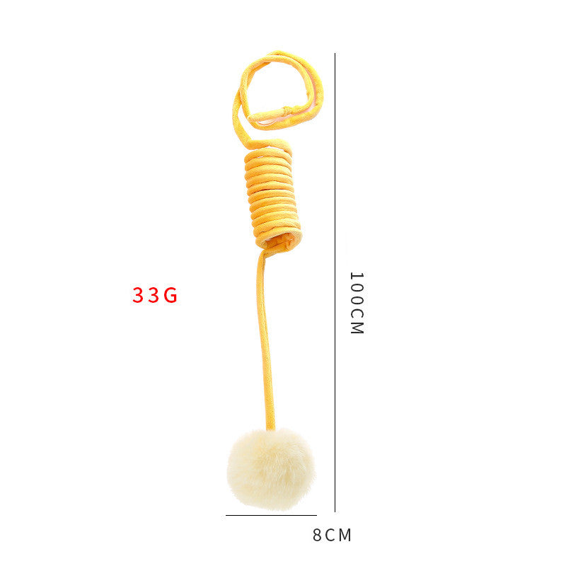 Cat spring toy wand with yellow coil and fluffy white pom ball