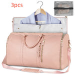 Light pink waterproof duffel bag with open top, tassel zipper pulls, shoulder strap