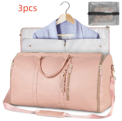 Light pink waterproof duffel bag with open top, tassel zipper pulls, shoulder strap