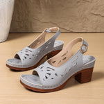 Light gray peep-toe platform sandals with geometric cutouts and round buckle mid heel