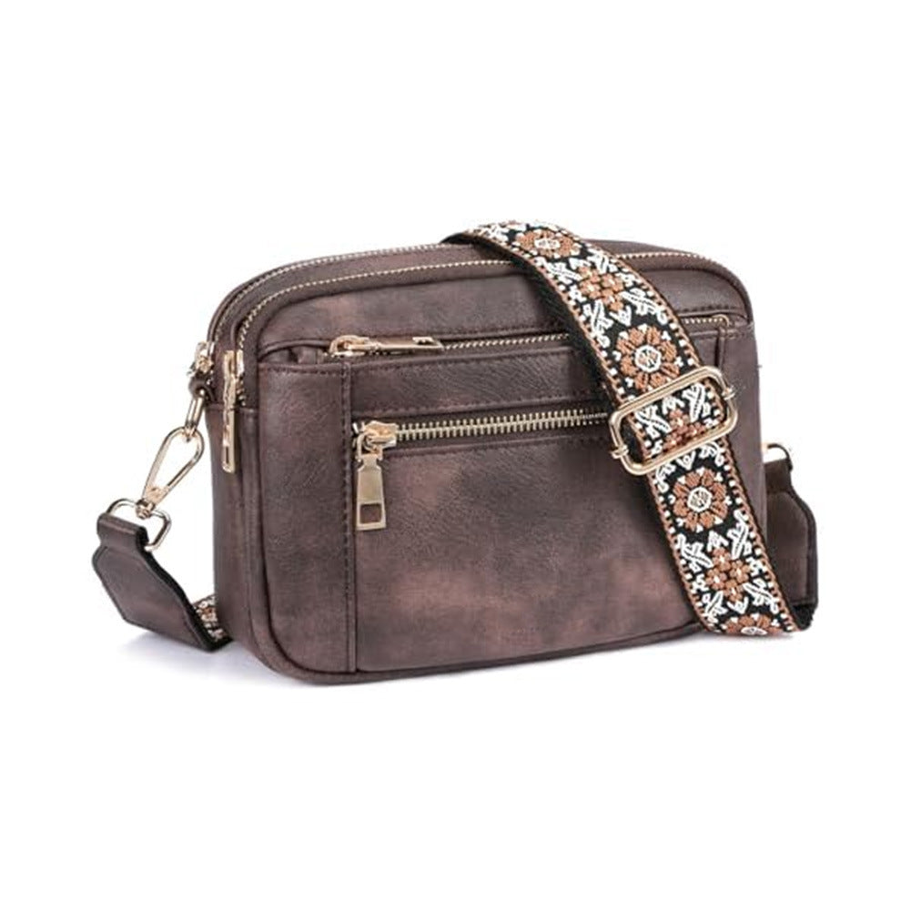 Crossbody bag in dark brown with triple zippers and floral embroidered strap