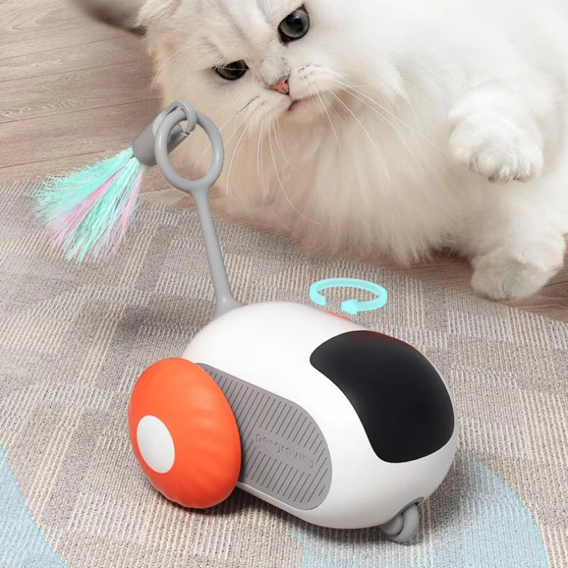 White and orange cat chase car toy with feather brush attachment