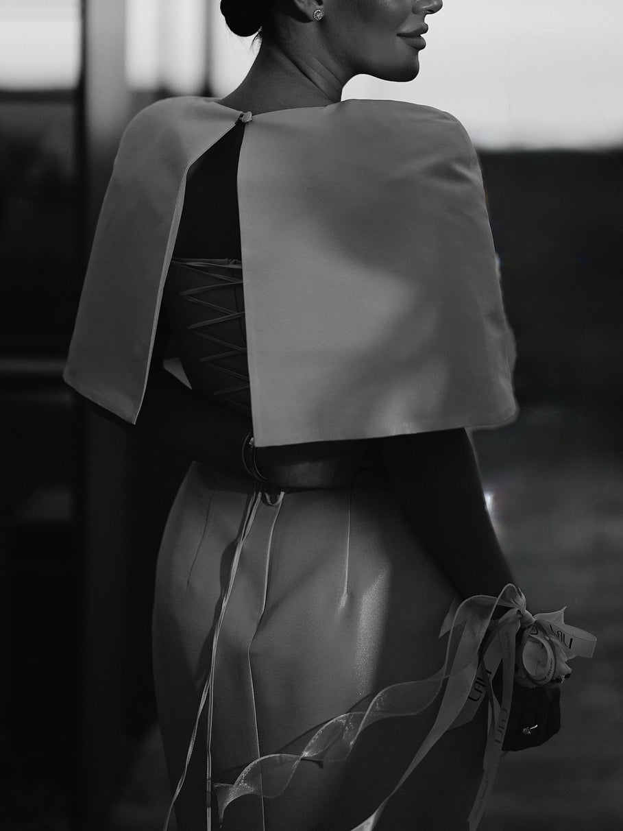 Satin cape-style top and fitted maxi dress, back view, dark satin fabric, ribbon tie