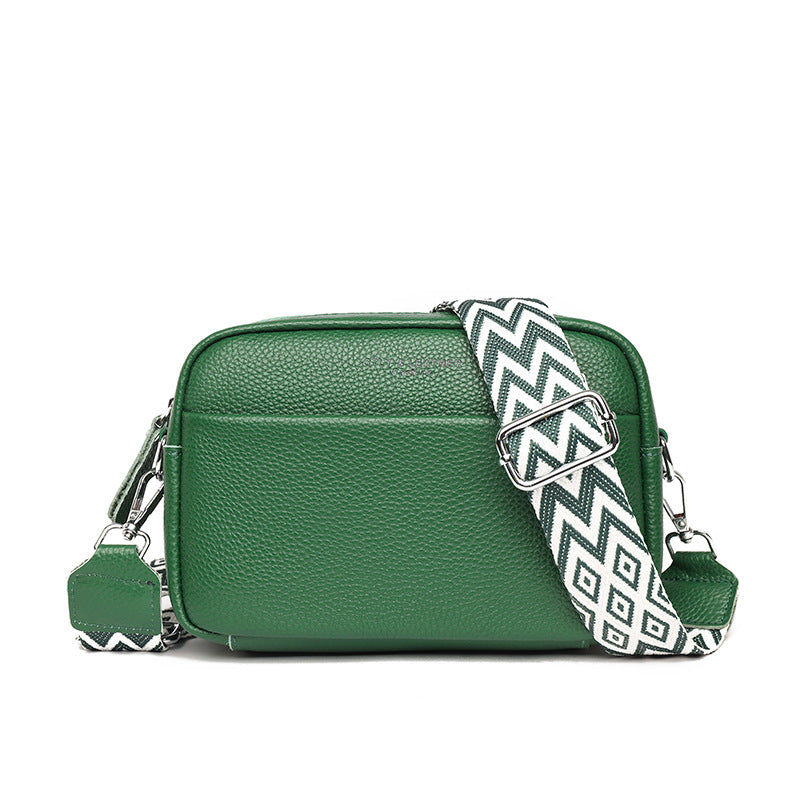 Green small square leather crossbody bag with zip top and wide rhombus embroidered strap