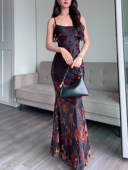 Black floral maxi dress with spaghetti straps and square neckline, fitted silhouette