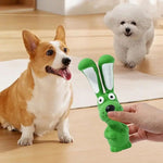 Green latex rabbit squeaky chew toy with white inner ears, held out for play