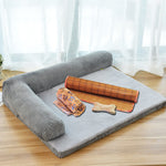 Gray pet dog bed with ribbed side bolsters and light gray plush mat