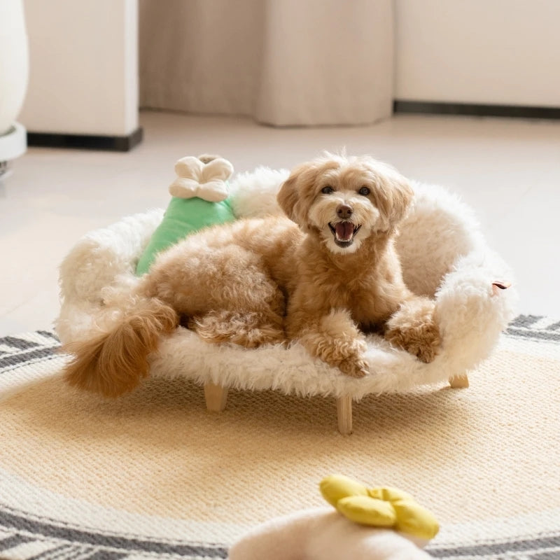Luxury wooden pet bed with fluffy white cover, brown dog, and green toy pillow on top