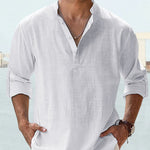 White pullover shirt with stand collar, short button placket, and long sleeves