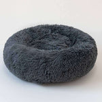 Round shaggy pet sleep bed in dark grey, shown from above with deep inner cushion