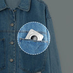 Mini thermal photo printer tucked in a denim jacket pocket