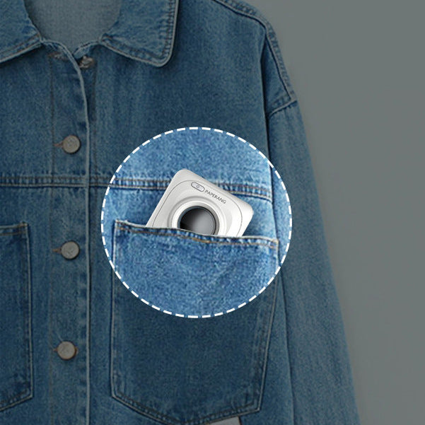 Mini thermal photo printer tucked in a denim jacket pocket