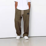 Waffle loose drawstring trousers in dark brown/olive with straight, roomy fit
