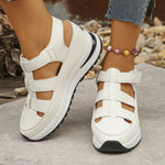 White wedge platform sandals with cutout uppers and hook-and-loop straps