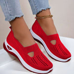 Women's mesh slip-on flats in red, cutout toe and white sole.