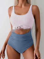 Women's striped one-piece swimsuit with blue high-waist bottom and spaghetti straps