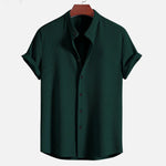 Dark green short sleeve button-up shirt with open collar and vertical textured finish