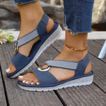 Blue woven-strap sandals with gold metal buckle and open toe, thick sole