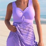 Lavender one-piece swimsuit with ruched chest pad and lace-patterned skirt overlay