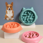 Green slow feeder pet bowl with raised ridges and paw-shaped anti-gulp bumps