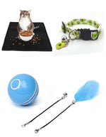 Blue LED rolling cat toy ball with green collar, black tether straps, and feather