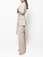 Beige belted blazer and high-waist pants set, side profile, belted waist, wide-leg trousers.