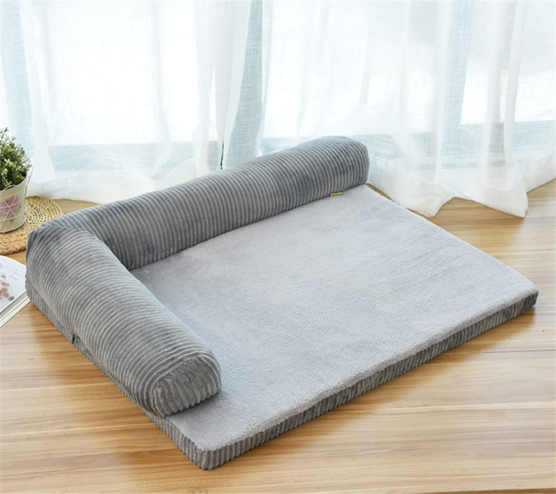Gray pet dog bed with ribbed bolsters and light gray plush sleeping surface