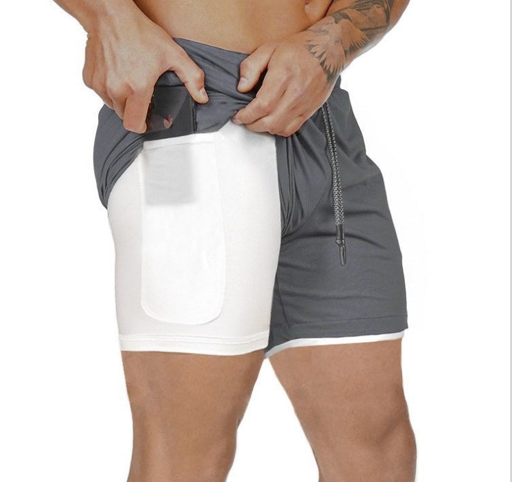 Dark gray compression sports shorts with white front panel and drawstring