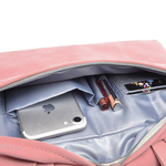 Pink laptop bag interior with phone and laptop compartments, zip top opening.