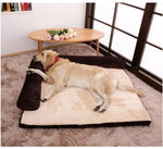 Dark brown pet dog bed with ribbed bolsters and cream plush mat