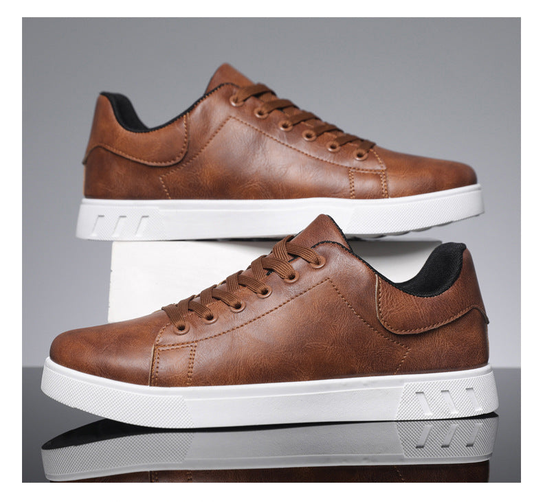 Brown lace-up casual sneakers with round toe, contrast inner lining, and white sole
