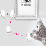 LED rolling cat toy ball in white with black trim near a cat