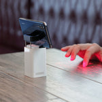 Laser projection keyboard with built-in mouse projecting red keys, fingertip pointing