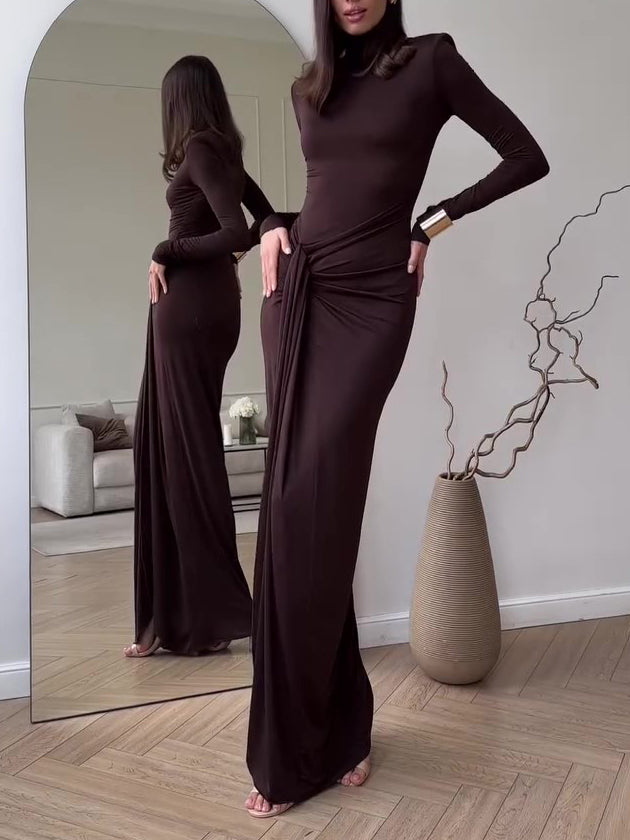 Dark brown long-sleeve maxi dress with ruched waist and fitted silhouette