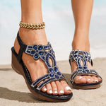 Black wedge sandals with blue jeweled T-strap, elastic ankle band, open toe