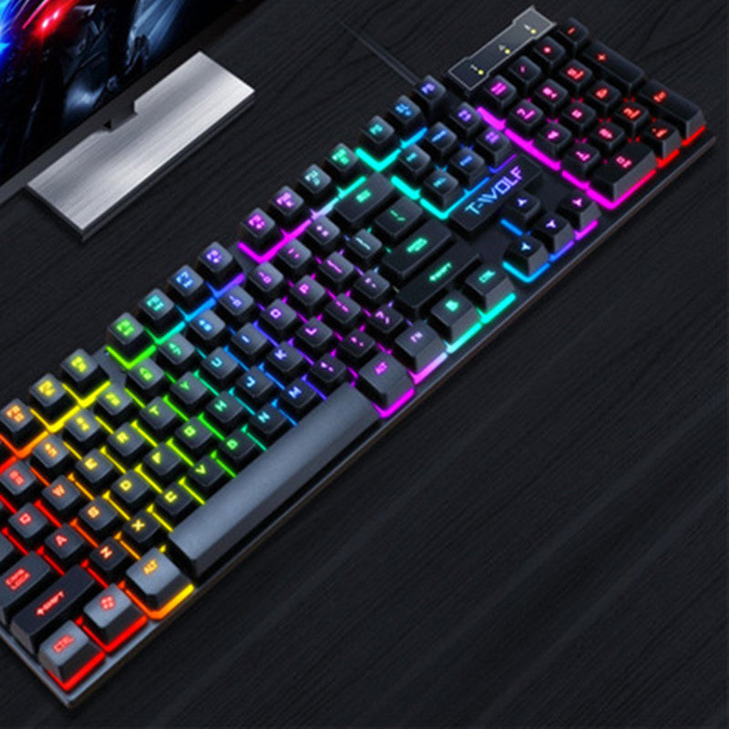 Gaming keyboard close-up with multicolor RGB keys and T-VOLF logo on panel