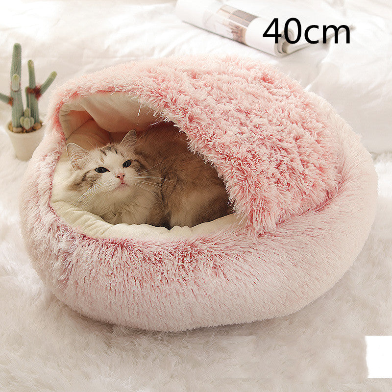 Plush round pet bed with pink shag top and cream base, 40cm