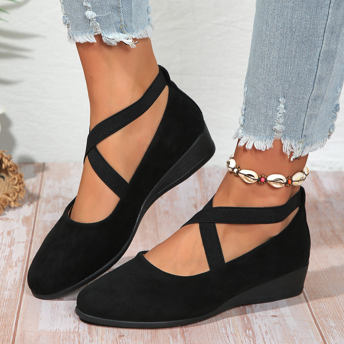 Women’s pointed toe cross-strap wedge flats in black suede with elastic band at ankle