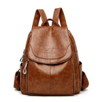 Brown PU leather backpack with front flap, front pocket, adjustable shoulder straps