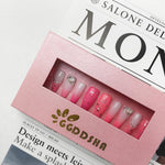 Pink press-on acrylic nail set in display box with short rhinestone and glitter nail designs
