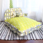 Small teddy dog pet bed with lime green geometric top and animal print side panels