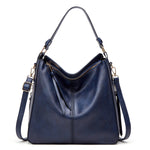 Dark blue hobo bucket bag with top zipper and dual shoulder straps