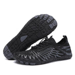 Black unisex water shoes with lace-up upper and textured non-slip outsole