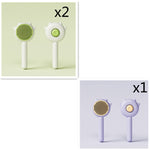 Pet grooming massage comb set with two green round bristle brushes on white handles